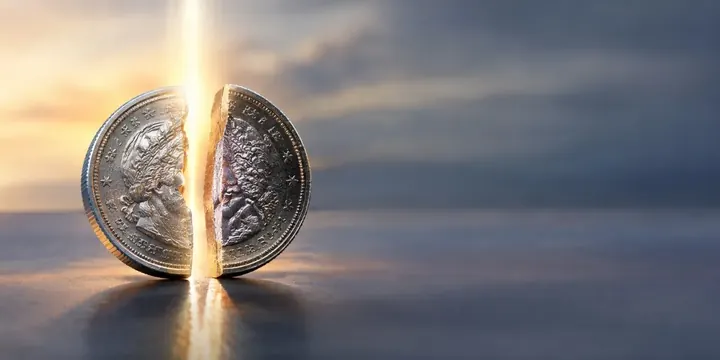 Coin being split into two halves by a beam of light